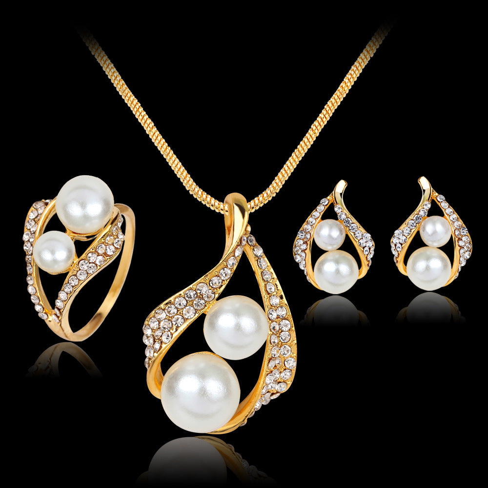 Earrings Necklace Set with Ring Pearl Jewelry 3 Piece featuring elegant pearls and a floral design in gold and rhinestones.